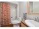 Compact bathroom featuring a shower-tub combination and vanity at 1073 Xenon St, Golden, CO 80401