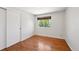 Bedroom features hardwood floors, a window and a closet at 1073 Xenon St, Golden, CO 80401