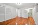 A well-lit room featuring hardwood floors and an ensuite bathroom at 1073 Xenon St, Golden, CO 80401