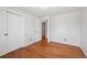 Bedroom view of closet and entry with hardwood floors at 1073 Xenon St, Golden, CO 80401