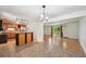 Kitchen featuring wood cabinets, tile floors, stainless steel appliances and access to the adjacent dining area at 1073 Xenon St, Golden, CO 80401