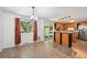 Eat-in kitchen featuring tile floors, wood cabinets, stainless steel appliances and access to the backyard at 1073 Xenon St, Golden, CO 80401