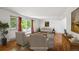 Bright living room with wood floors, ample natural light from the sliding glass doors and neutral decor at 1073 Xenon St, Golden, CO 80401
