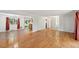 Open-concept living area featuring wood floors, and an entryway leading to additional rooms in the home at 1073 Xenon St, Golden, CO 80401