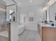 Stylish bathroom with dual vanities, tile flooring, glass shower and separate tub at 900 Eldorado Ln, Louisville, CO 80027