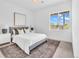 Cozy bedroom with a large window, comfortable bed, and stylish decor elements at 900 Eldorado Ln, Louisville, CO 80027