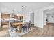Open dining room with wood table, modern lighting, and seamless flow to other living areas at 900 Eldorado Ln, Louisville, CO 80027