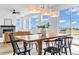 Bright dining space with large windows, stylish lighting and neutral decor creates an inviting atmosphere at 900 Eldorado Ln, Louisville, CO 80027