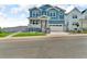 Beautiful two-story home with a well-maintained front yard, inviting porch, and attached garage at 900 Eldorado Ln, Louisville, CO 80027