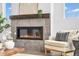 Modern fireplace with stone surround and wooden mantel creating a cozy focal point in the living area at 900 Eldorado Ln, Louisville, CO 80027