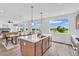Open-concept kitchen features an island with a sink, and view of green outdoor space at 900 Eldorado Ln, Louisville, CO 80027