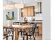 Open floor plan with dining area, kitchen island and stylish lighting, perfect for entertaining at 900 Eldorado Ln, Louisville, CO 80027