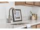 Close-up of a kitchen sink with modern faucet and neutral decor for a clean, stylish look at 900 Eldorado Ln, Louisville, CO 80027
