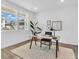 Bright home office featuring modern furniture, hardwood floors, and an abundance of natural light at 900 Eldorado Ln, Louisville, CO 80027