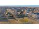 Aerial view of residential neighborhood, with blue sky and mountain views at 1392 S Duquesne Cir, Aurora, CO 80018