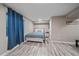 Bedroom with blue accents and wood-look flooring at 1392 S Duquesne Cir, Aurora, CO 80018