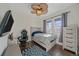 Comfortable bedroom featuring a ceiling fan and large windows at 1392 S Duquesne Cir, Aurora, CO 80018