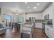 Bright kitchen features stainless appliances, granite countertops, and tile backsplash at 1392 S Duquesne Cir, Aurora, CO 80018