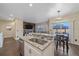 Open concept kitchen featuring stainless appliances, granite counters and breakfast bar at 1392 S Duquesne Cir, Aurora, CO 80018