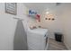 Laundry room with side-by-side washer and dryer, plus ironing board at 1392 S Duquesne Cir, Aurora, CO 80018