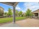 Inviting backyard featuring manicured lawn and a covered patio area at 23895 E Rocky Top Pl, Aurora, CO 80016