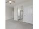 Bright bedroom featuring neutral walls, a ceiling fan and multiple doors at 23895 E Rocky Top Pl, Aurora, CO 80016