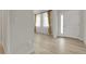 Bright entryway featuring sleek floors, white trim, and modern front door at 23895 E Rocky Top Pl, Aurora, CO 80016