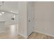 Hallway leads to the kitchen and features neutral decor at 23895 E Rocky Top Pl, Aurora, CO 80016