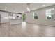 Modern kitchen with sleek floors, stainless appliances, and a kitchen island at 23895 E Rocky Top Pl, Aurora, CO 80016