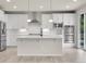 Modern kitchen featuring stainless appliances, subway tile backsplash, and quartz countertops at 23895 E Rocky Top Pl, Aurora, CO 80016