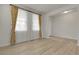 Spacious living room featuring sleek floors, recessed lighting, and large windows at 23895 E Rocky Top Pl, Aurora, CO 80016