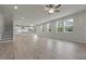 Open concept living space featuring stairs, sleek floors, and large windows at 23895 E Rocky Top Pl, Aurora, CO 80016