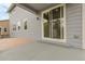 Charming patio area with sliding glass door that offers seamless indoor-outdoor living at 23895 E Rocky Top Pl, Aurora, CO 80016