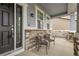 Inviting front porch with decorative stone accents and cozy seating area at 23895 E Rocky Top Pl, Aurora, CO 80016