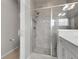 Bathroom featuring an enclosed glass shower with dual shower heads and tile surround at 23895 E Rocky Top Pl, Aurora, CO 80016