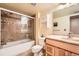 Cozy bathroom featuring a shower-tub combination with tiled surround and a modern vanity at 14130 E Temple Dr # T01, Aurora, CO 80015