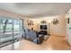 Open living room with hardwood floors, a sliding glass door, and stylish decor at 14130 E Temple Dr # T01, Aurora, CO 80015