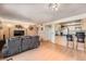 Comfortable living room open to the kitchen, featuring hardwood floors and a cozy atmosphere at 14130 E Temple Dr # T01, Aurora, CO 80015