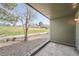 A view from the patio that has gravel and a nice view of a grass field at 14130 E Temple Dr # T01, Aurora, CO 80015
