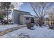 Community center with snow covered landscaping at 9877 Grove St # C, Westminster, CO 80031