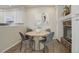 Bright dining area with a round table and four chairs at 9877 Grove St # C, Westminster, CO 80031