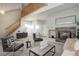 Open living room showcasing a fireplace and high ceilings at 9877 Grove St # C, Westminster, CO 80031