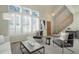 Bright living room with vaulted ceilings, fireplace, and ample natural light at 9877 Grove St # C, Westminster, CO 80031