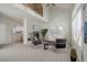 Spacious living area with a fireplace and kitchen view at 9877 Grove St # C, Westminster, CO 80031