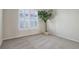 Spacious spare bedroom with large window and neutral decor at 9877 Grove St # C, Westminster, CO 80031