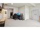 Finished carpeted basement bedroom with gray walls, desk and a walk-in closet with easy access to bathroom at 23814 E 36Th Pl, Aurora, CO 80019