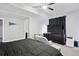 Spacious carpeted bedroom with ceiling fan, dark furniture and a cozy chair to relax in at 23814 E 36Th Pl, Aurora, CO 80019