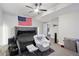Spacious carpeted bedroom with ceiling fan and a cozy chair and easy access to bathroom at 23814 E 36Th Pl, Aurora, CO 80019