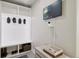 Mudroom with cubbies, bench seating, and a TV screen for viewing weather or security camera feeds at 23814 E 36Th Pl, Aurora, CO 80019