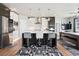 Bright eat-in kitchen featuring a large island with bar seating and modern appliances at 23814 E 36Th Pl, Aurora, CO 80019